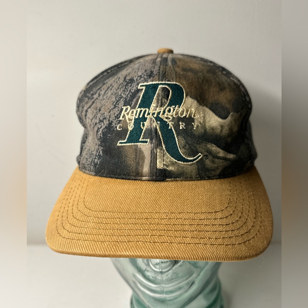 VINTAGE REMINGTON HEADWEAR MADE IN THE USA CAMO HAT BLACK BILL ADJUSTABLE HAT